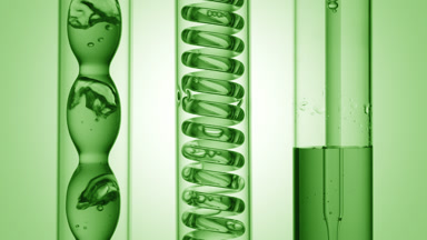 Green liquid bubbling in condenser, flowing to tube, green ramp