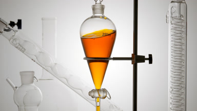 Orange hydrosol waves along inner walls, citrus freshness