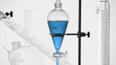 Blue liquid drains from funnel, bubbles rise, light grey bg