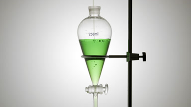 Lotion poured in funnel, bubbles form and rise underwater