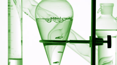 Clear liquid with air bubbles rising inside on white background