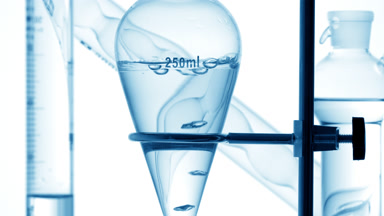 Mineral water with air bubbles rising inside the solution