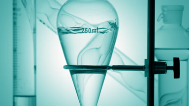 Pale cyan liquid injected, waves forming on cyan background