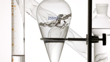 Oxygenated water injected, filling flask and creating splashes