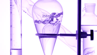 Clear liquid injected, splashes inside on white background