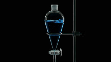 Blue liquid injected in funnel, splashes form on black