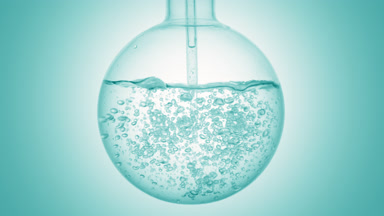 Pale cyan liquid dropper injection swirls in flask, cyan ramp