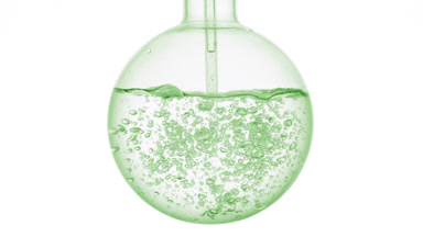 Make-up remover dropper injection swirls and bubbles in flask