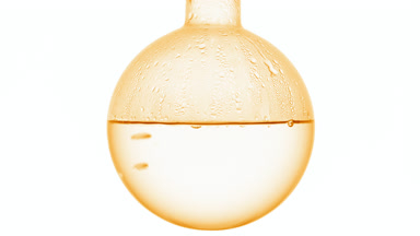 Dimethicone copolyol boils in round-bottom flask, condensing