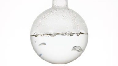 Allantoin solution boils in round-bottom flask, condensing