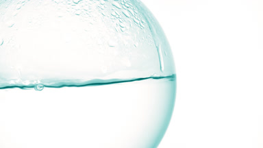 Make-up remover boiling in flask, bubbles and condensation