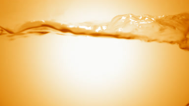 Royal jelly solution boiling in flask, bubbles and waves
