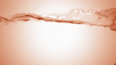 Clear liquid boiling in flask, bubbles and waves, beige bg