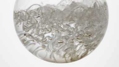 Oxygenated water boiling in round bottom flask, bubbles rise