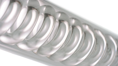 Butylene glycol fills spiral of inclined coil condenser