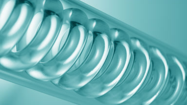 Pale cyan liquid fills spiral condenser on cyan ramp