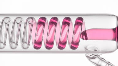 Makeup remover fills coiled condenser visible in glass tube flow
