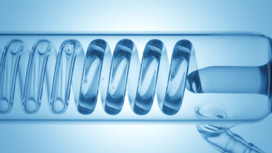 Oxygenated water fills coil condenser visible in glass tube flow