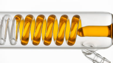 Retinol solution fills coli condenser in glass tube flow
