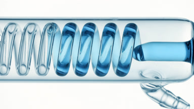 Oxygenated water fills horizontal coil condenser in glass tube