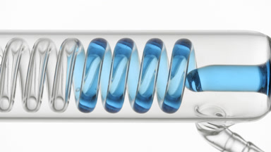 Panthenol solution fills horizontal coil condenser in glass tube