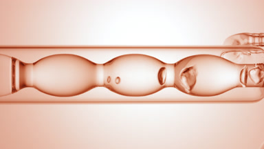 Clear liquid drains from bulb condenser, beige ramp background