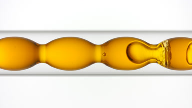 Papaya liquid extract fills and drains from bulb condenser glass