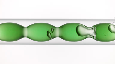 Chlorophyll solution fills and drains from bulb lab condenser