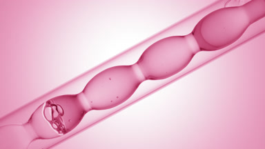 Pink liquid in inclined bulb condenser, pink ramp background