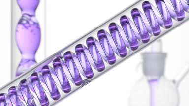 Violet liquid bubbling in lab coil, bulb condenser, on white