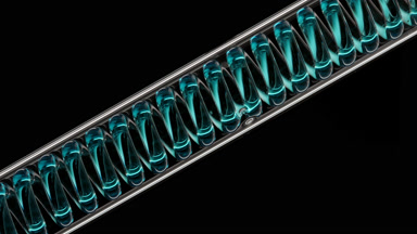Cyan liquid in inclined coil condenser on black background
