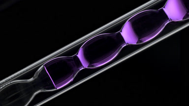 Acai berry hydrosol in inclined bulb laboratory condenser glass