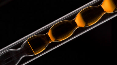 Propolis tincture inside inclined bulb lab condenser glass