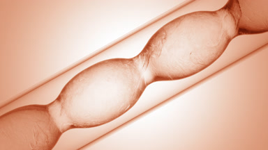 Clear liquids of varying density mixing in flask swirls on beige