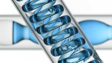 Blue liquid bubbling in spiral coil, bulb condenser on white