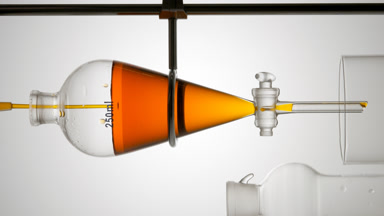 Sea buckthorn extract poured into separatory funnel cosmetic use