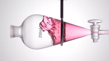Fragrance injected into separatory funnel splashes within liquid