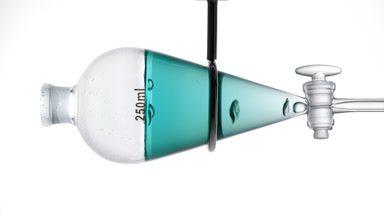Cyan transparent liquid with rising bubbles, grey backdrop