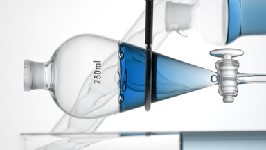 Blue tansy hydrosol with bubbles rising inside the clear liquid