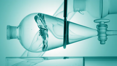 Pale cyan liquid injection forms waves on cyan ramp background
