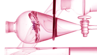Pink transparent liquid injection creates waves on white