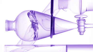 Clear liquid injection produces waves on white background