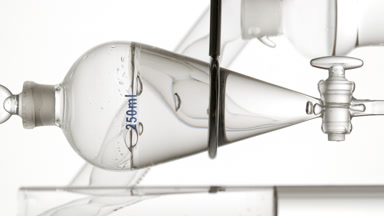 Glycolic acid drains, bubbles rise in funnel after valve opens