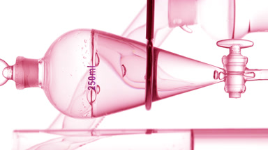 Make-up remover drains from funnel, bubbles rising inside view