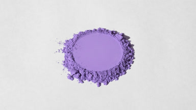 Violet Powder Pile with Round Impression on Light Grey Surface