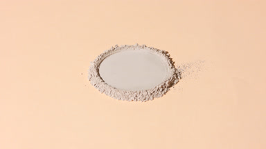 Beige Powder with Round Impression Under Dynamic Lighting