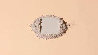 Dynamic Shot of Beige Powder Stack with Rectangular Mark