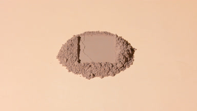 High-Angle Shot of Brown Powder with Rectangle Imprint