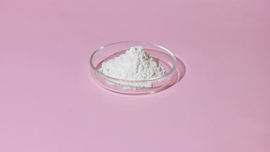 High-Angle Shot of White Powder in Glass Dish on Pink