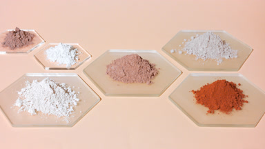Vertical Orbit Shot of Beige and Brown Powder Heaps